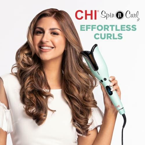 Woman with long curls holding a CHI Spin N Curl hair styler.
