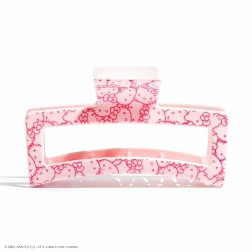 Pink Hello Kitty hair clip with cute design.