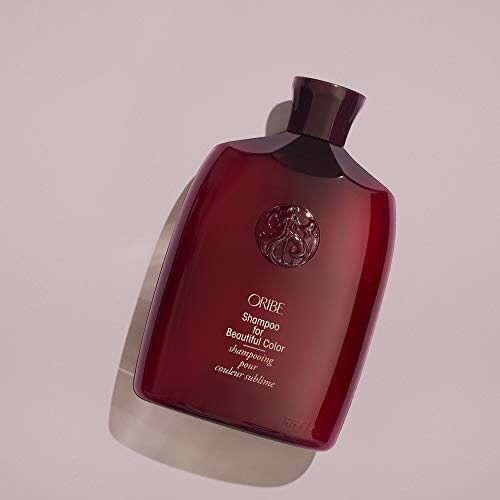 Red Oribe shampoo bottle on a light background