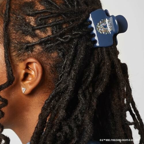 Person with dreadlocks wearing a hair clip