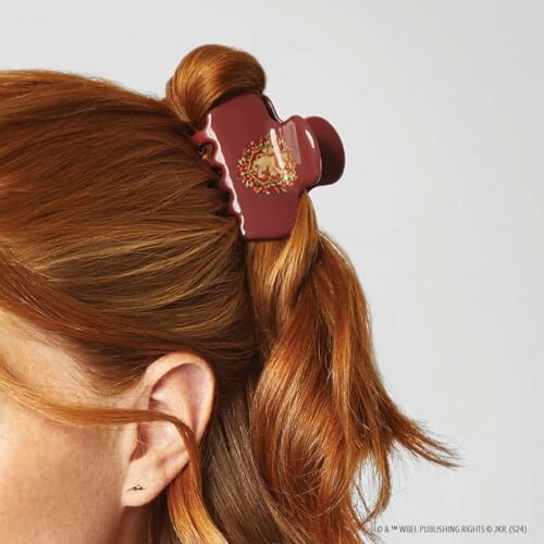 Woman with red hair wearing a decorative hair clip